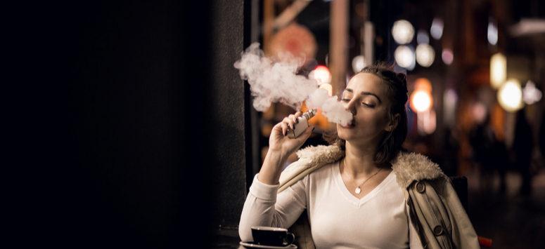 Woman vaping herbs 